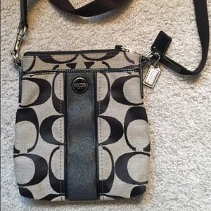 Black and silver Coach crossbody